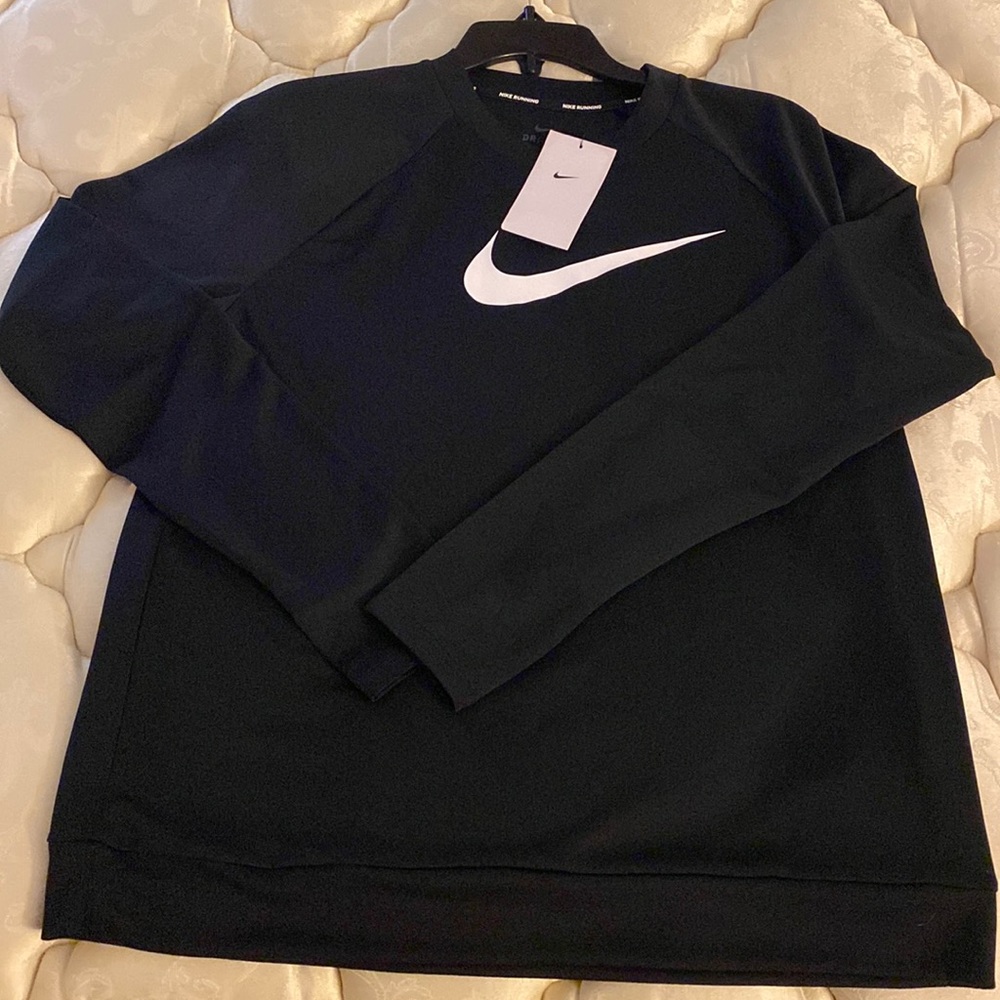 Woman’s Nike dri fit sweat top